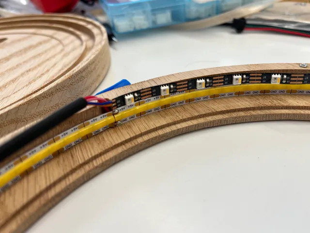 LED strips and a microcontroller installed inside the lamp's wooden frame
