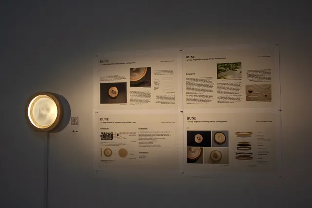 Dune lamp and design documentation displayed at an exhibition